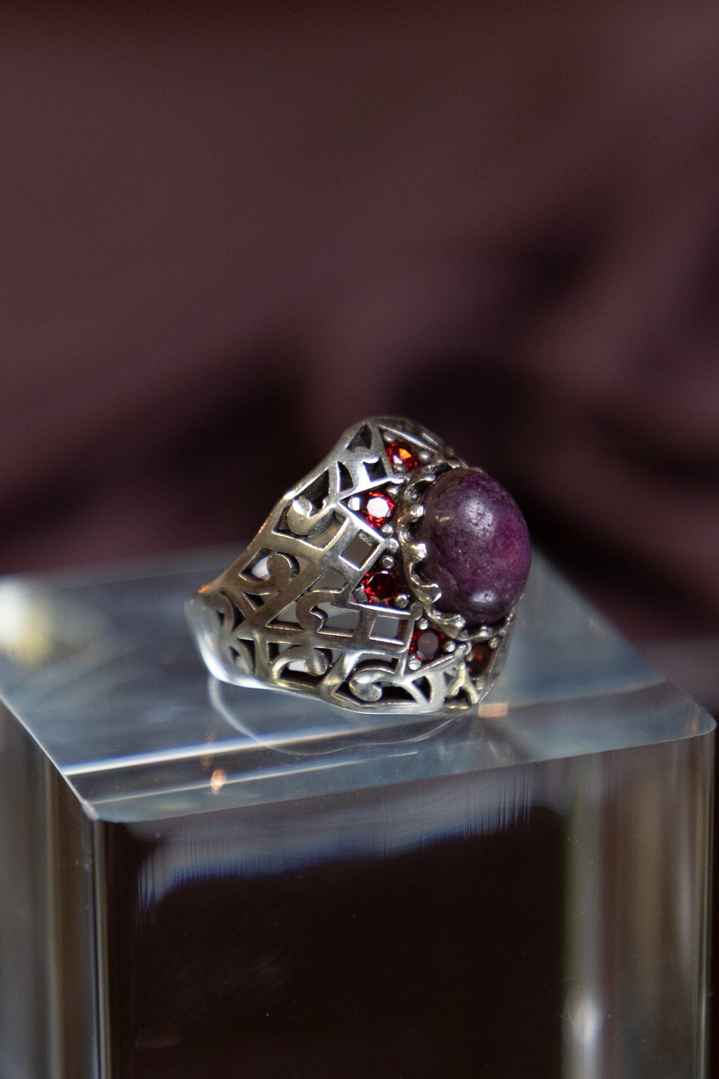 Amethyst center and Eight Faceted garnets stones inlaid in Silver Ring
