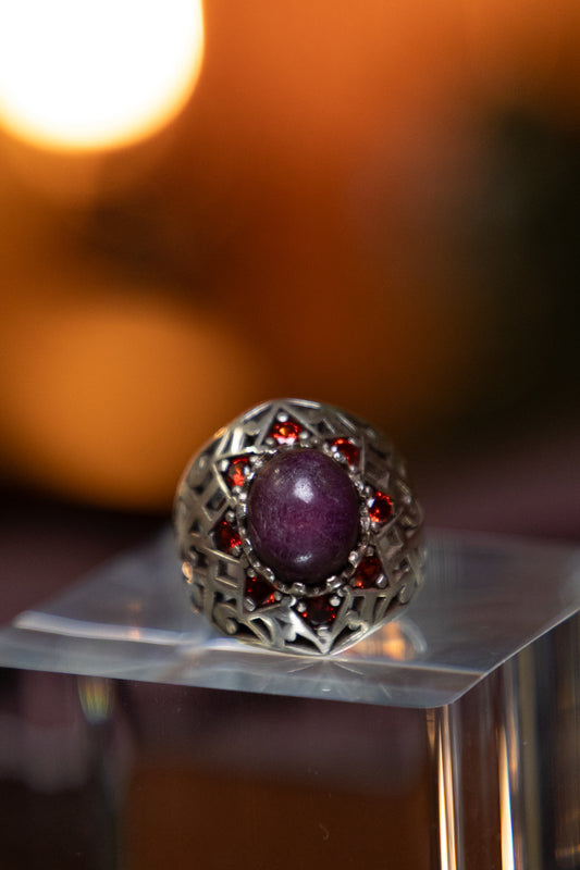 Amethyst center and Eight Faceted garnets stones inlaid in  Silver Ring